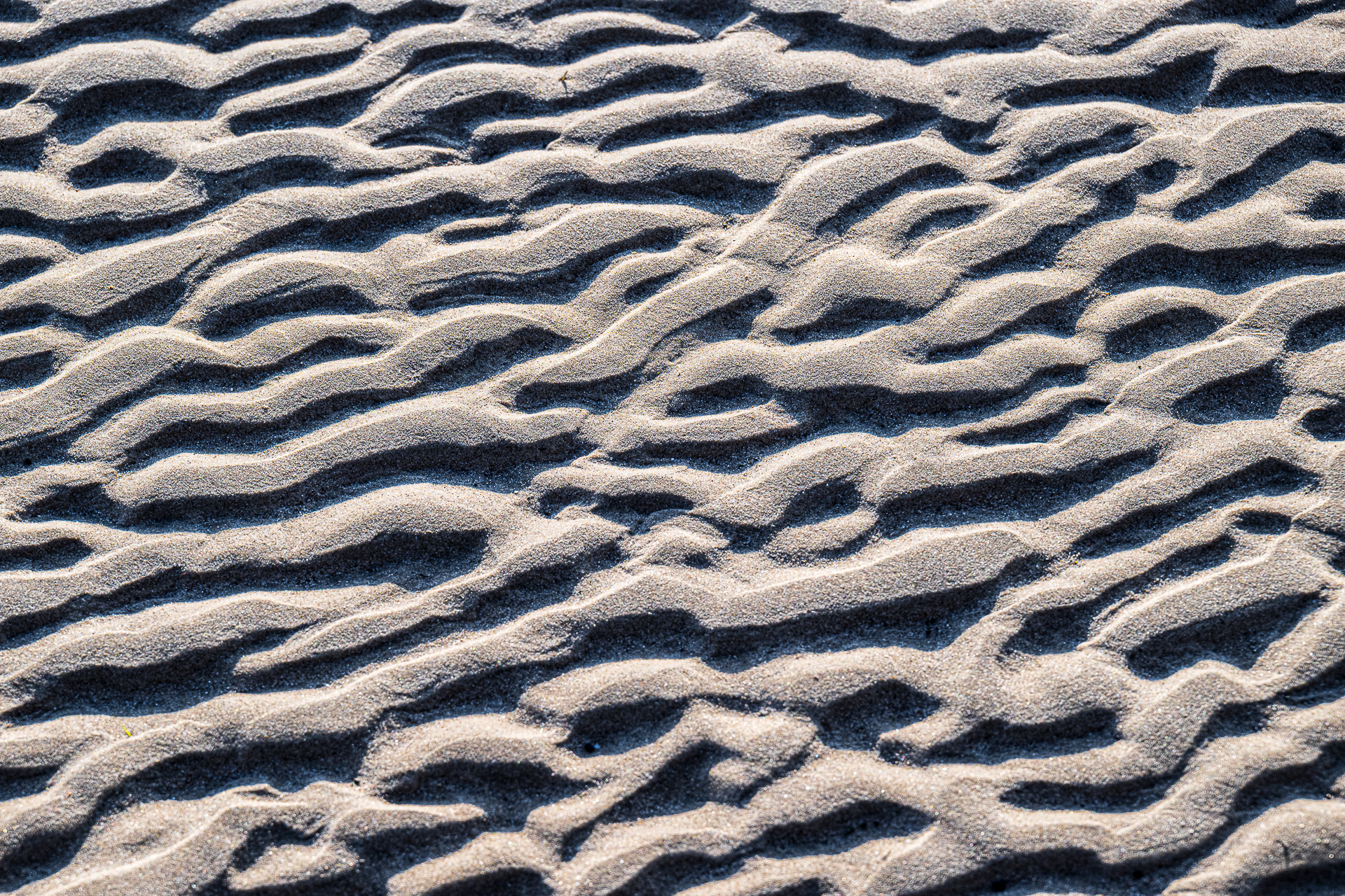 Wellen im Sand
